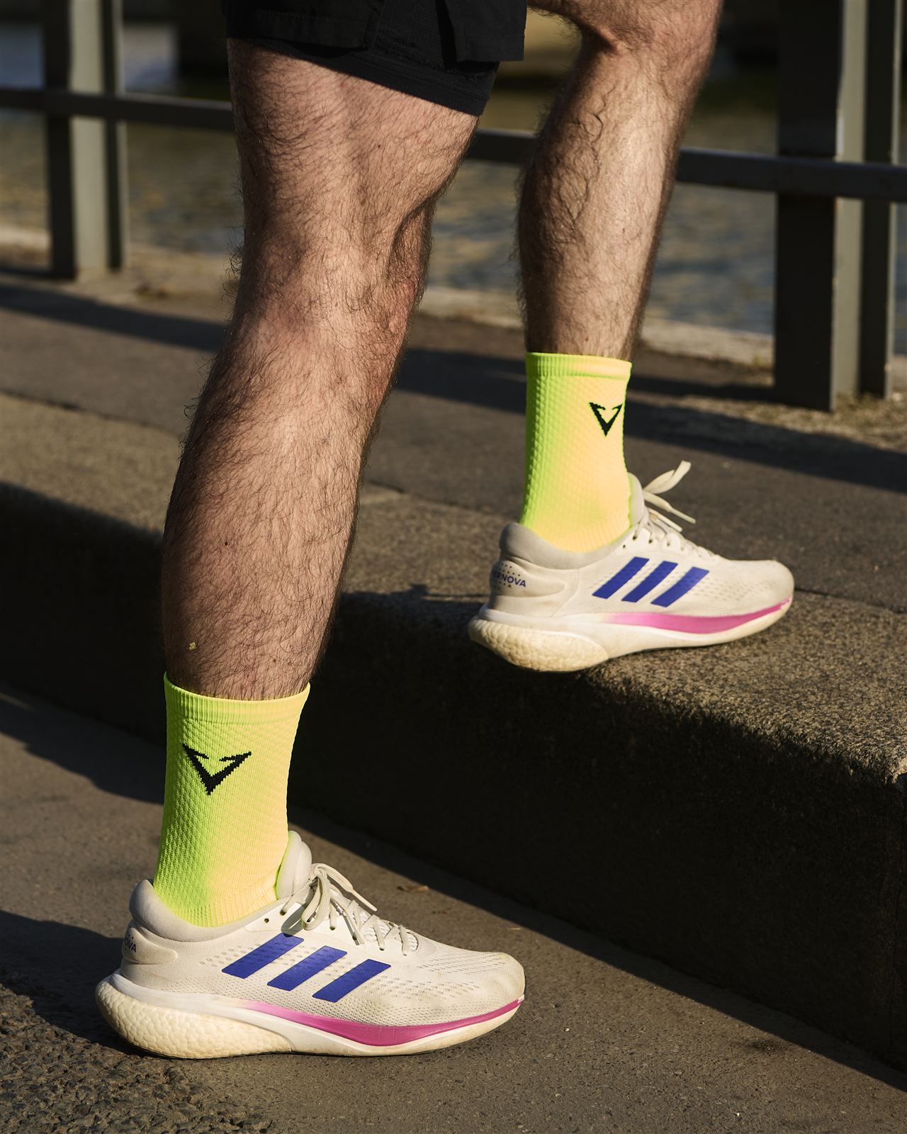 Runner wearing Vantage MAX neon compression socks